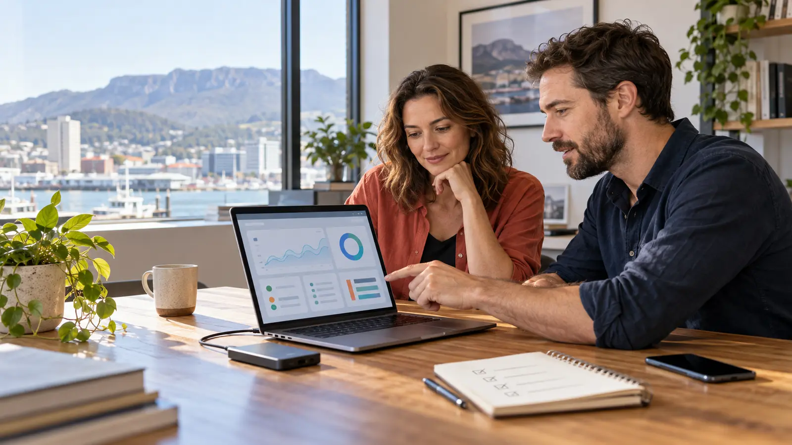 Hobart business owner and web developer reviewing a website maintenance dashboard